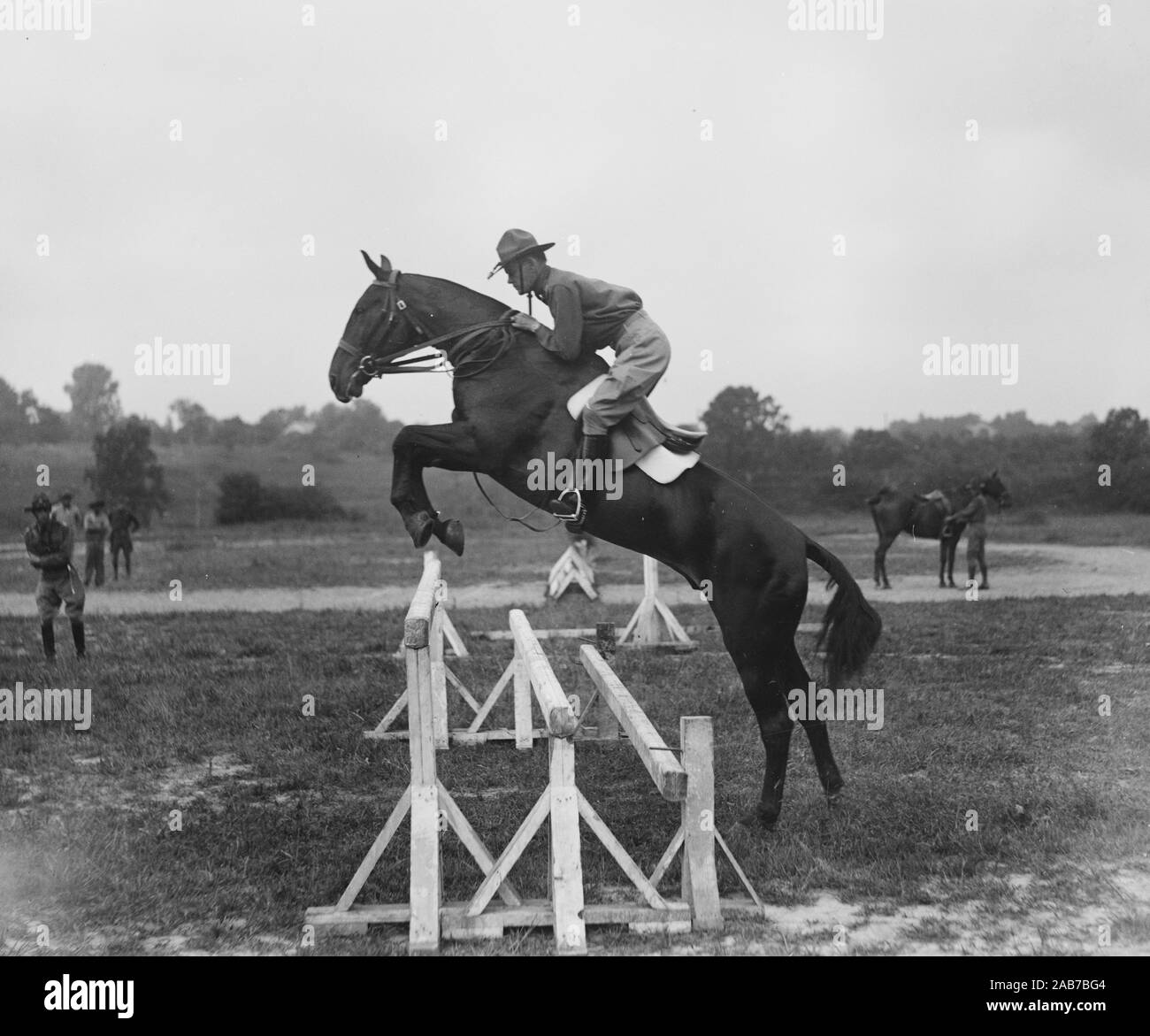 Man Horse jumping ca. 1928 Stock Photo - Alamy