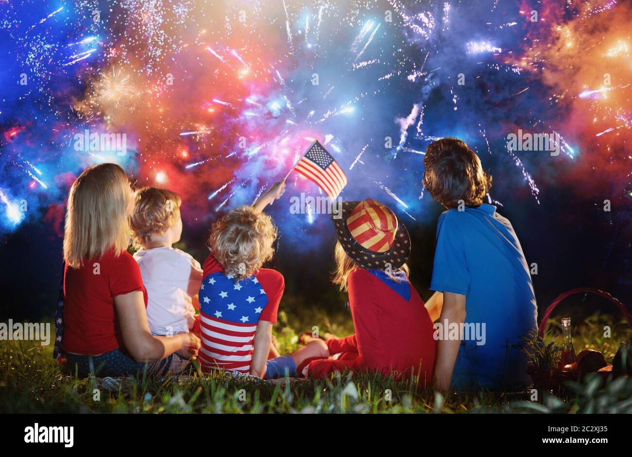 American family celebrating Independence Day. Picnic and fireworks on 4th of July in America 