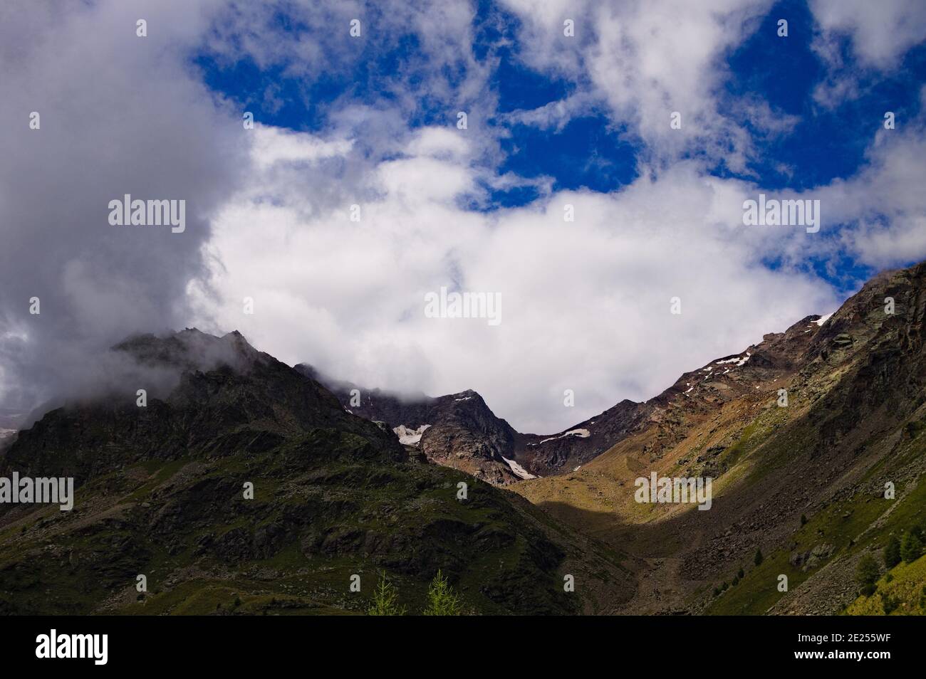 A mountain landscape with clouds in the sky on a summer day in the ...