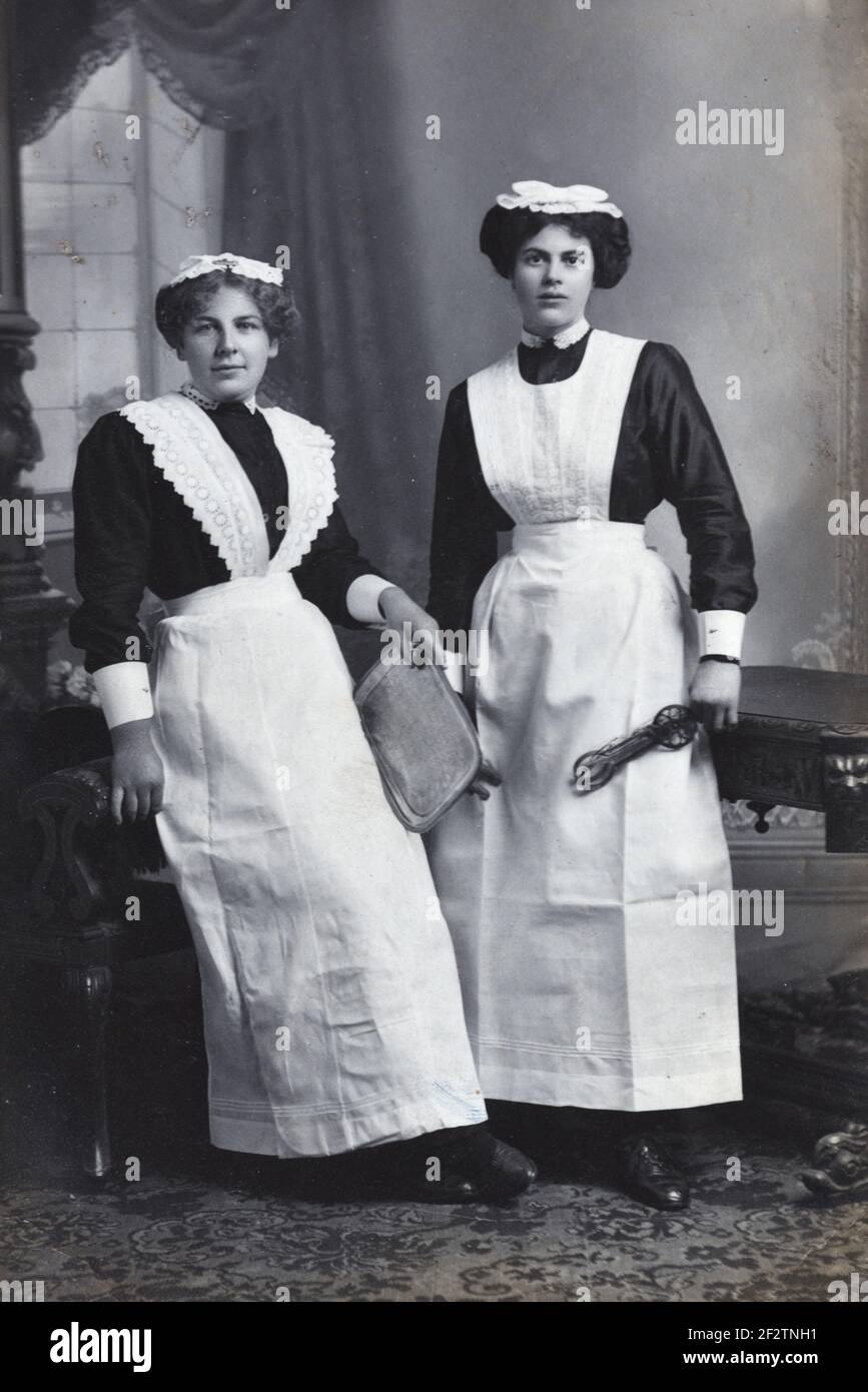 Full Length Portrait Of Two Maids Housemaids Victorian Maids Or Edwardian Maids Dressed In 