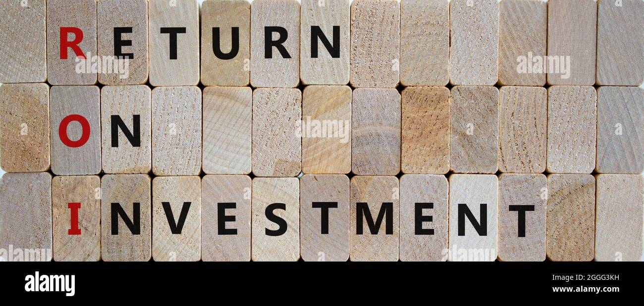 ROI, Return on investment symbol. Wooden blocks with words 'ROI, Return ...