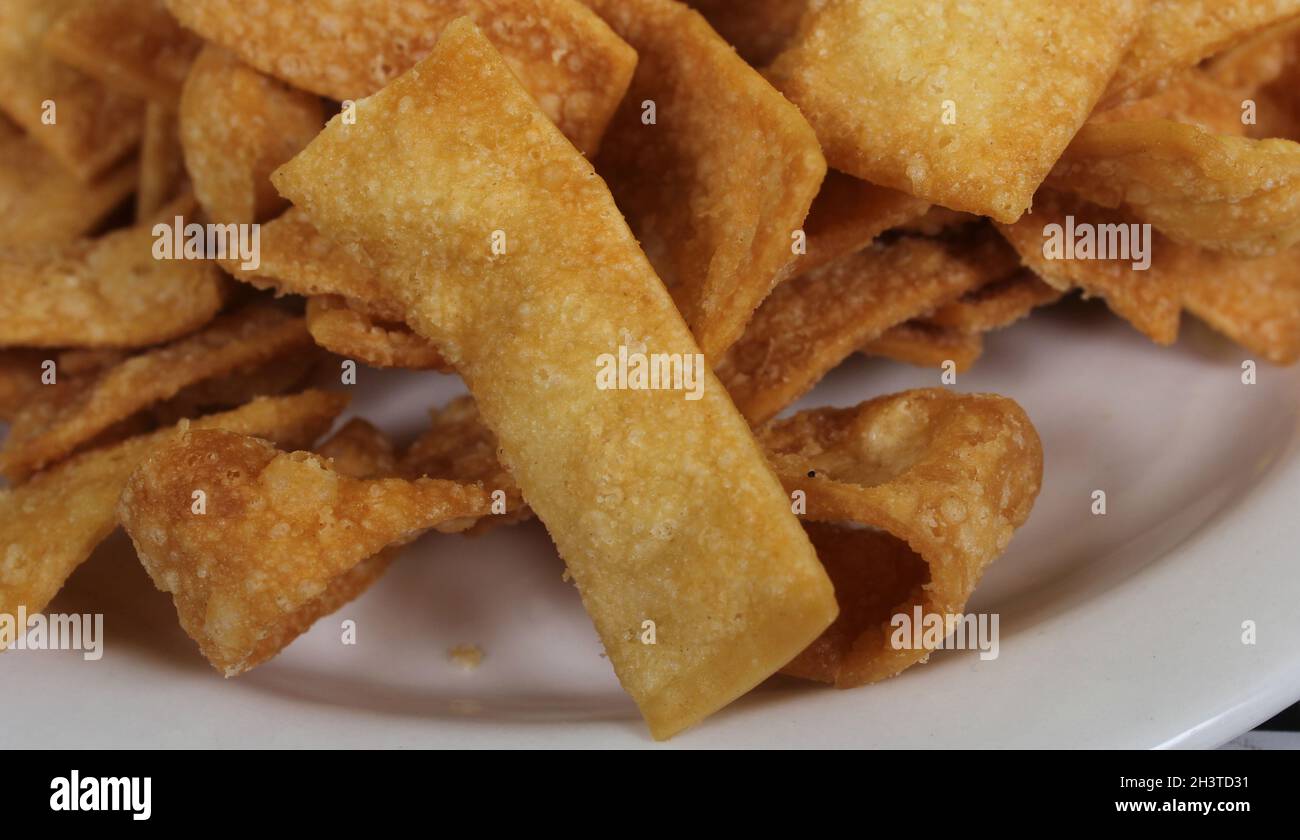 Fried Chinese Wonton Snack Chips Served in Asian Restaurant Stock Photo