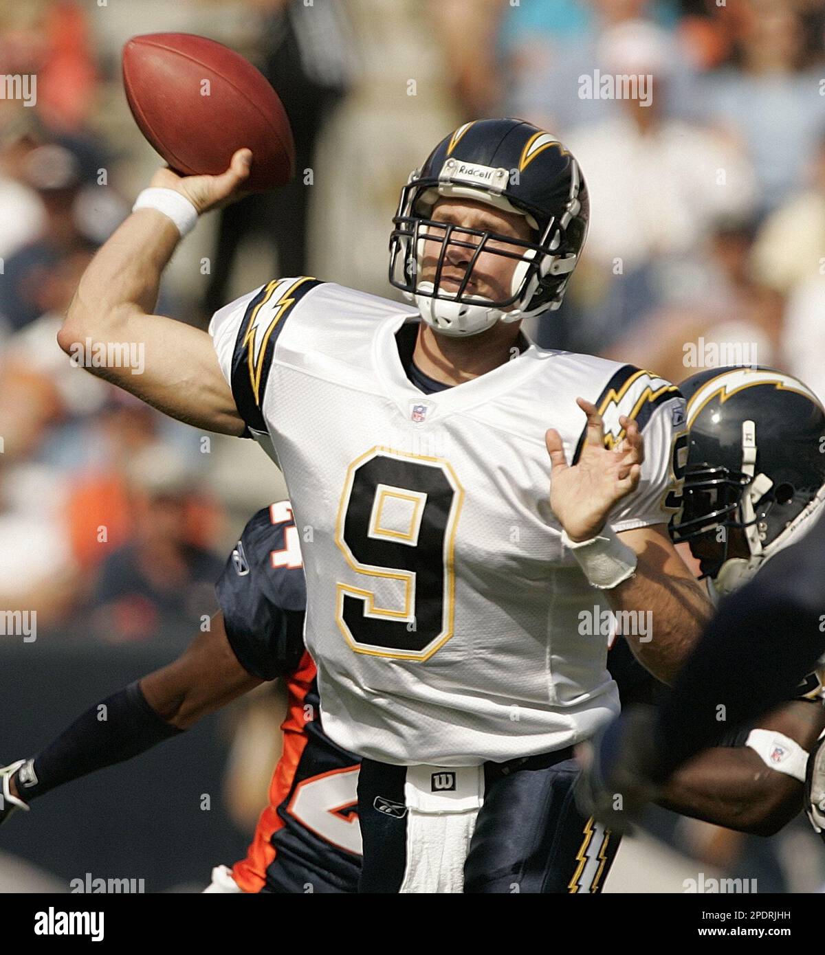 San Diego Chargers quarterback Drew Brees sets to fire a pass against ...