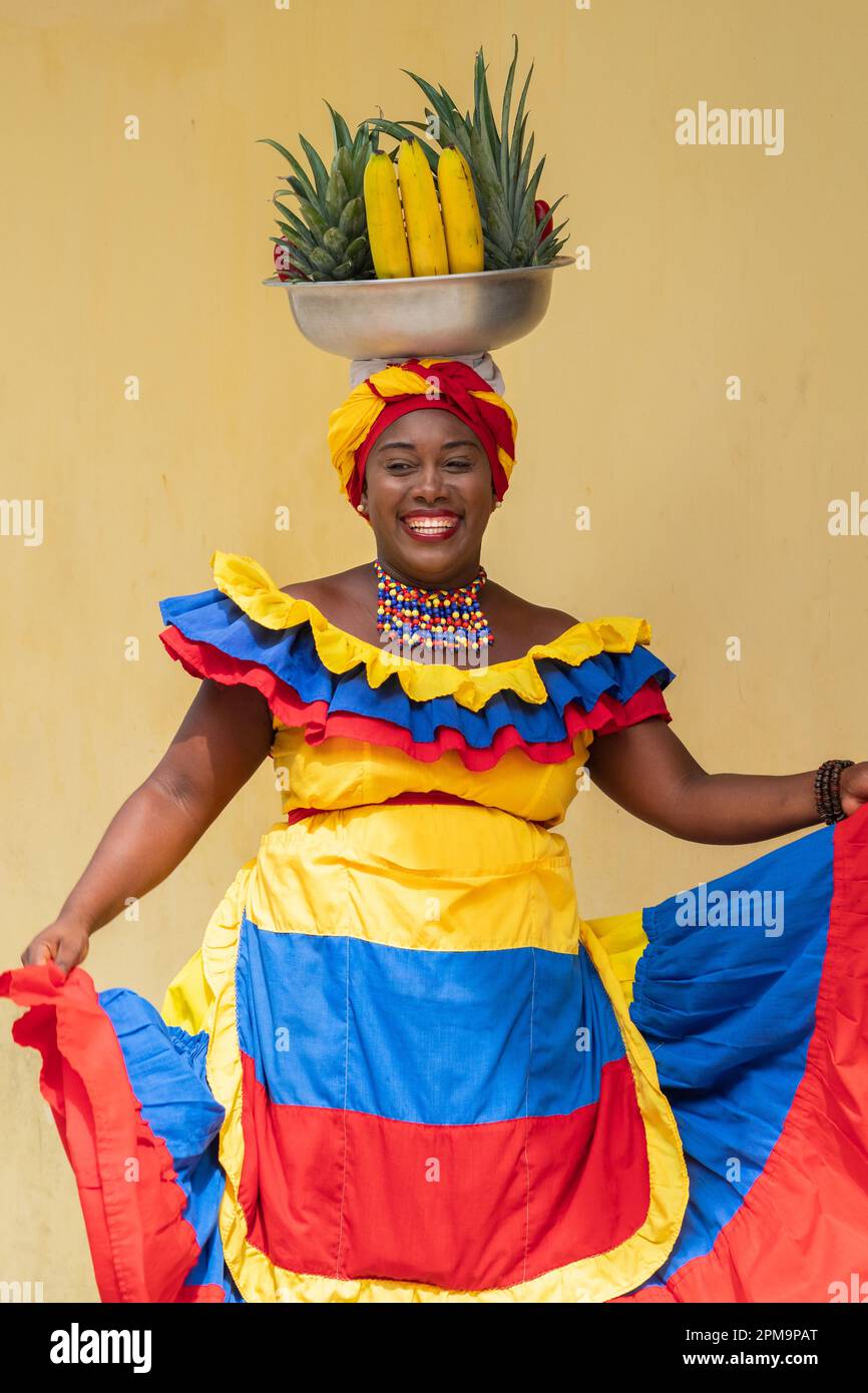 Happy Smiling Palenquera Fresh Fruit Street Vendor Dancing In Cartagena