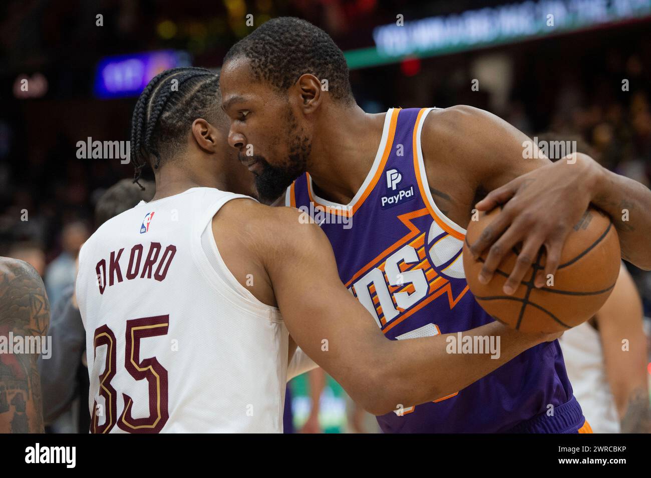 Cleveland Cavaliers' Isaac Okoro, right, gets a hug from Phoenix Suns