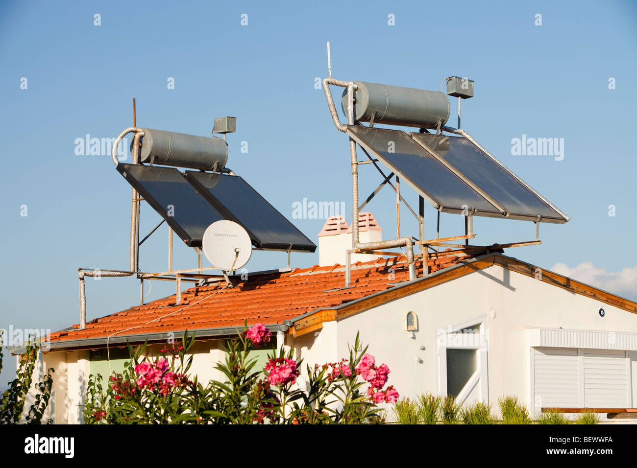 Solar water heaters on house roofs in Teos, Turkey Stock Photo - Alamy