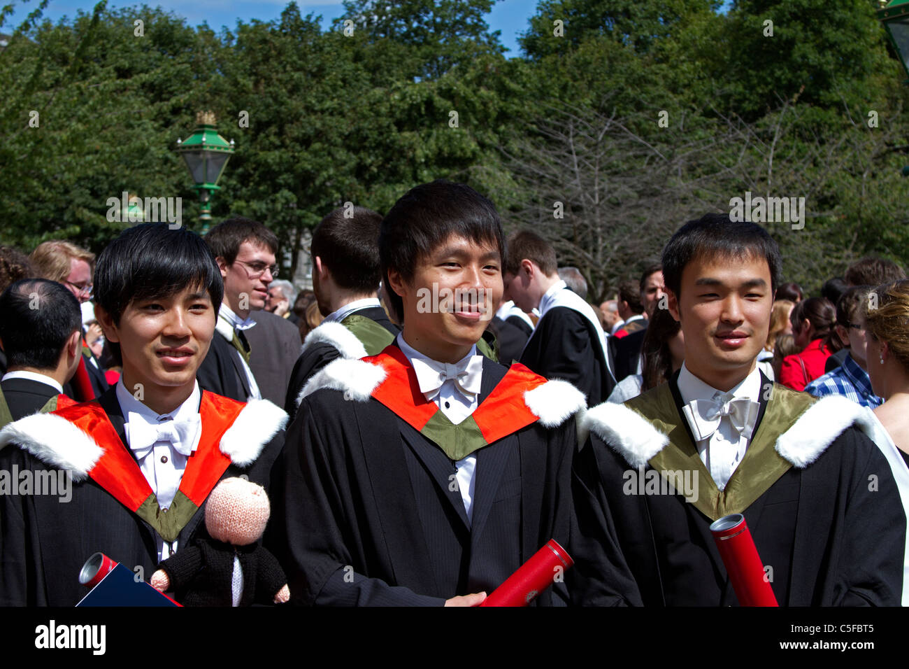 Three male foreign students Edinburgh University graduates in