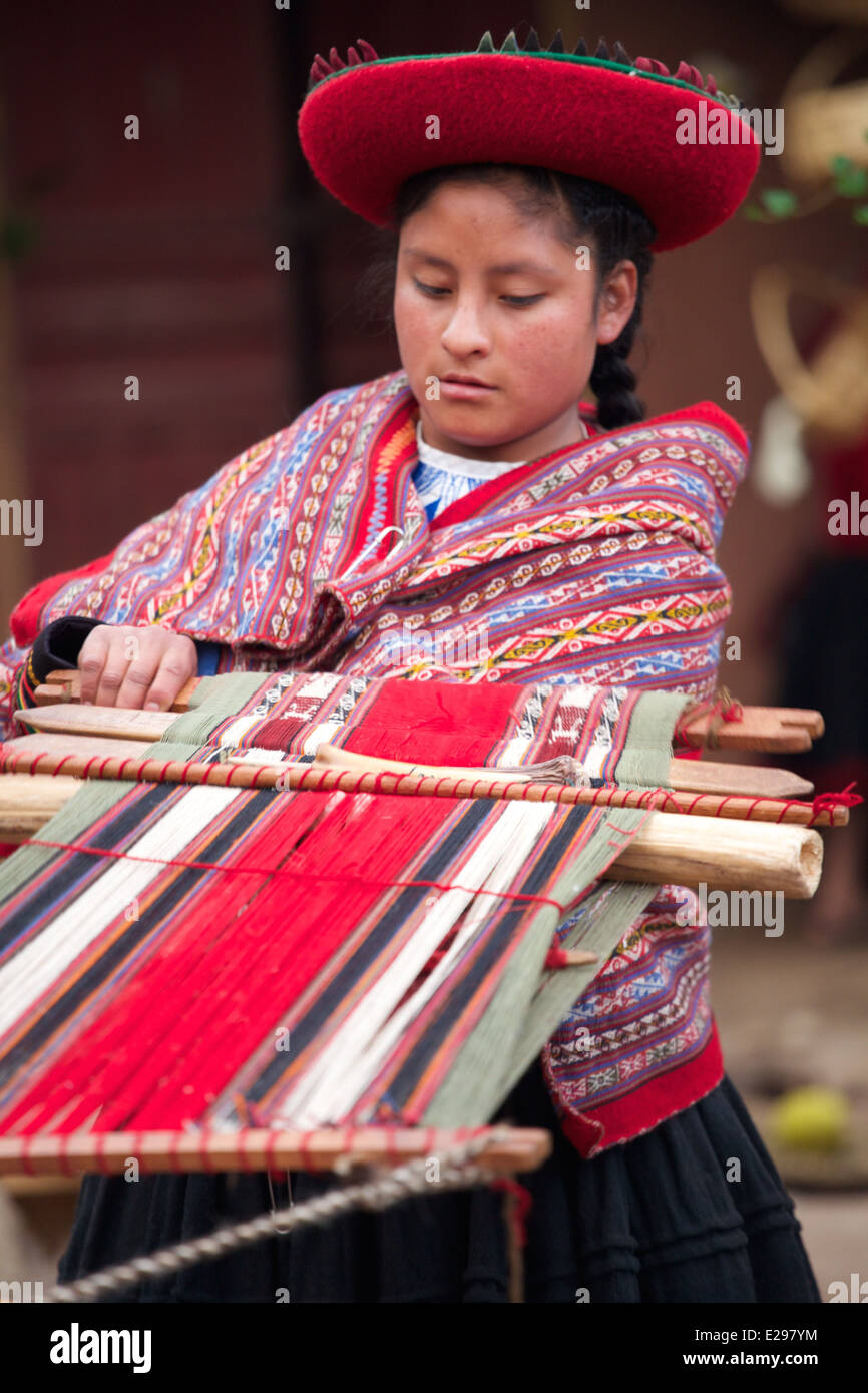 A Weaver Demonstrating Traditional Peruvian Weaving Techniques In The Chinchero Community