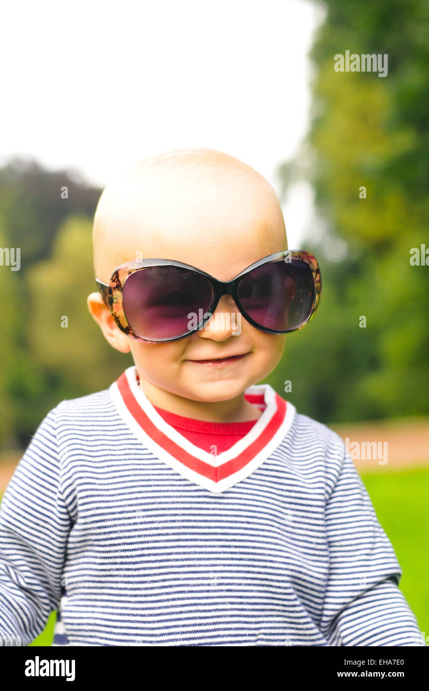 Boy portrait in big sunglasses looking at camera Stock Photo Alamy