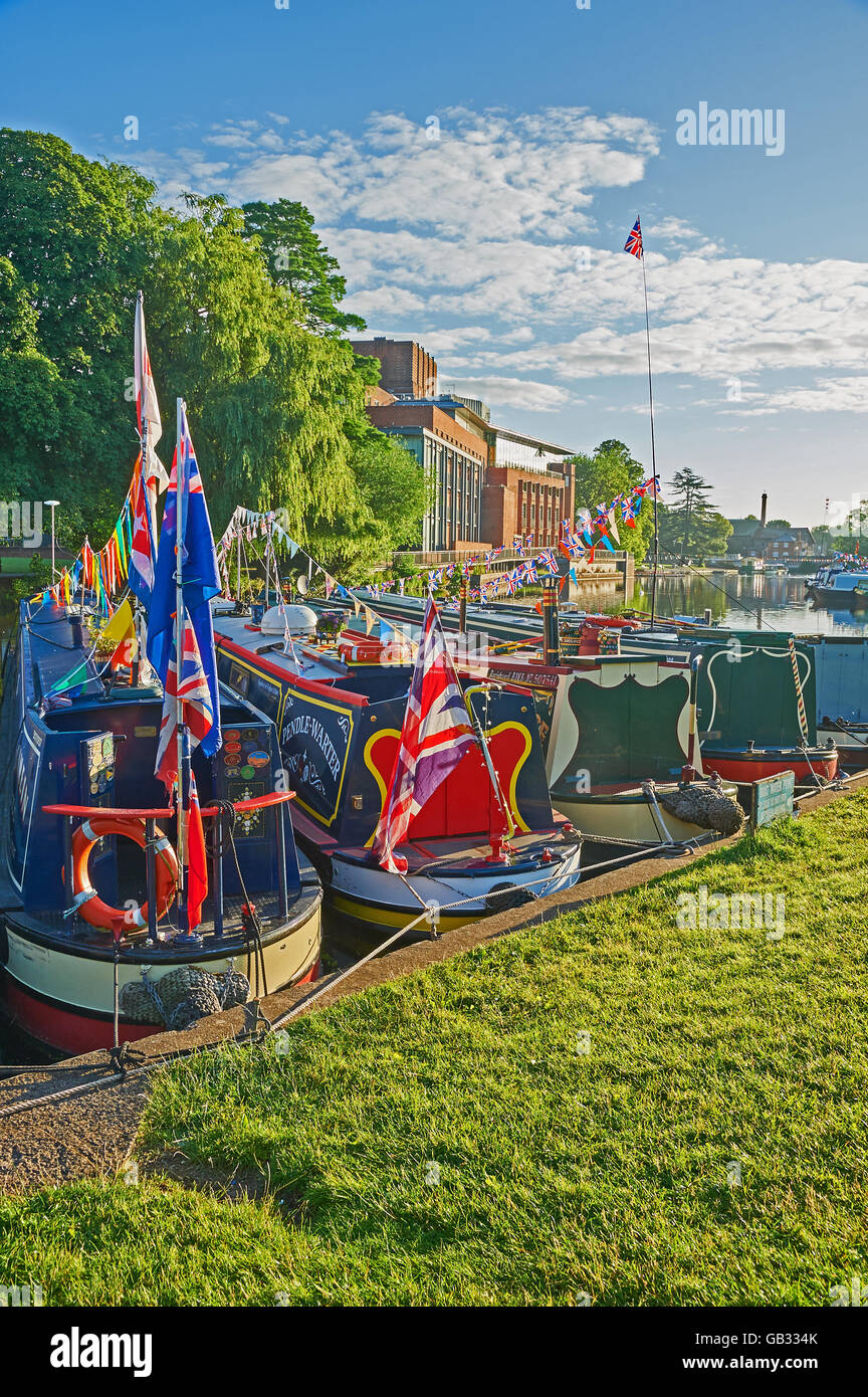 Stratford upon Avon with various river boats decked out in colourful