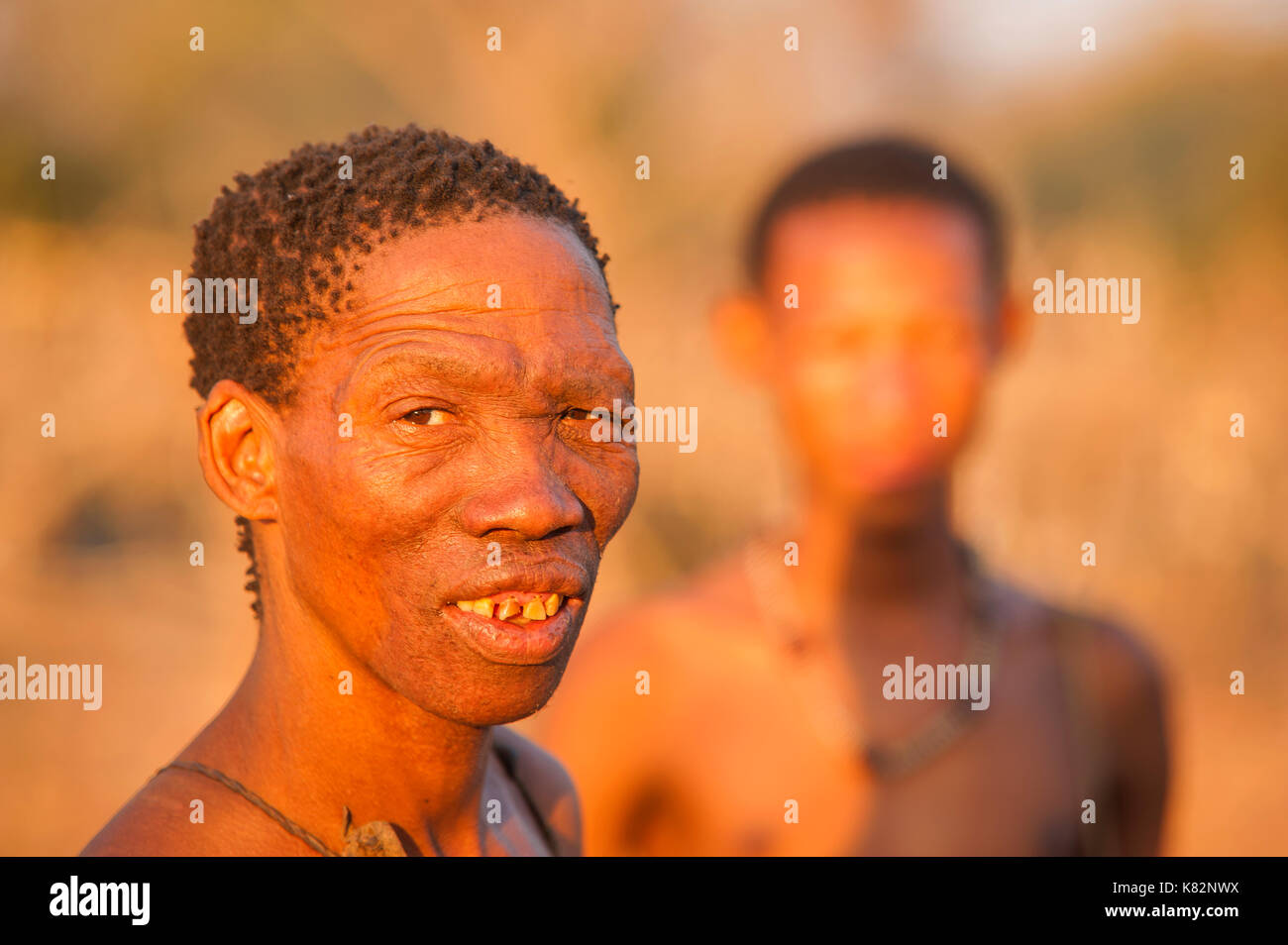 Ju Hoansi Or San Bushmen Hunter Gathering Around Camp Fire At Their Village Grashoek They Are