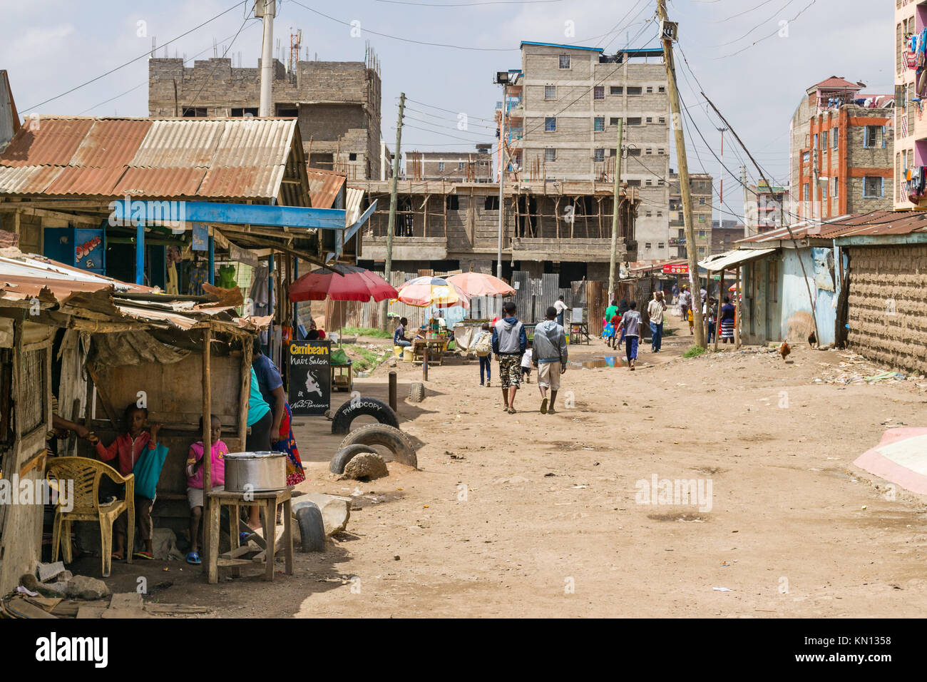 A view of part of the Huruma area of Nairobi with people going about ...