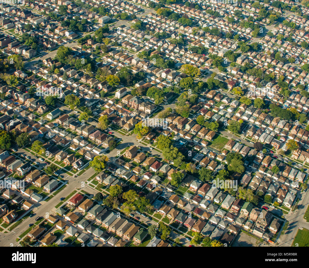 Aerial View Of Typical Suburban Neighborhood With Densely Packed Houses
