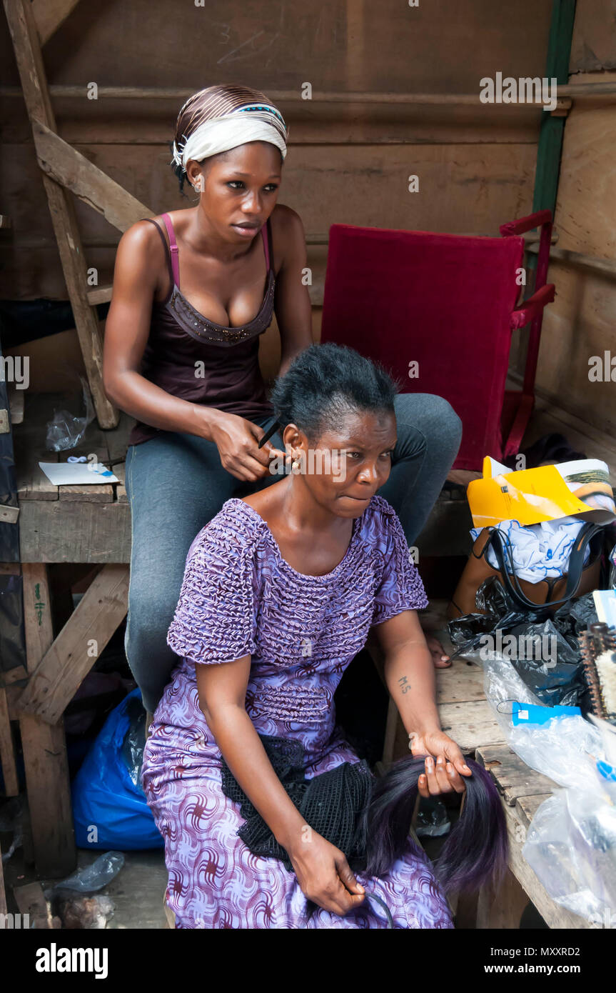 Original African Hair Braiding Ivorian Woman Visiting A Hairdresser At The Abidjan Market
