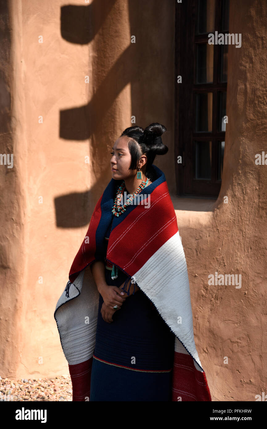 A Young Native American Hopi Woman Wearing Traditional Hopi Clothing Jewelry And Hairstyle At 