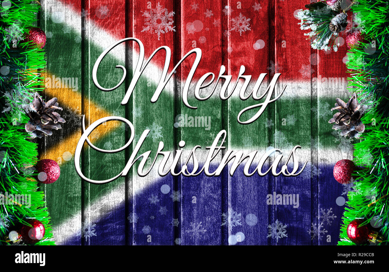 Merry christmas holiday concept with blurred flag image of South Africa